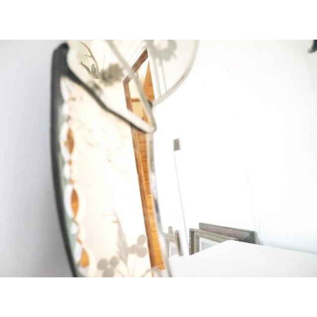 Large oval venitian wall mirror with all the vintage modelling that comes with age. All the floral attachments are...