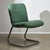 This exquisite chair from the 1970s presents a classic combination of practicality and style. Dressed in a vibrant mint...