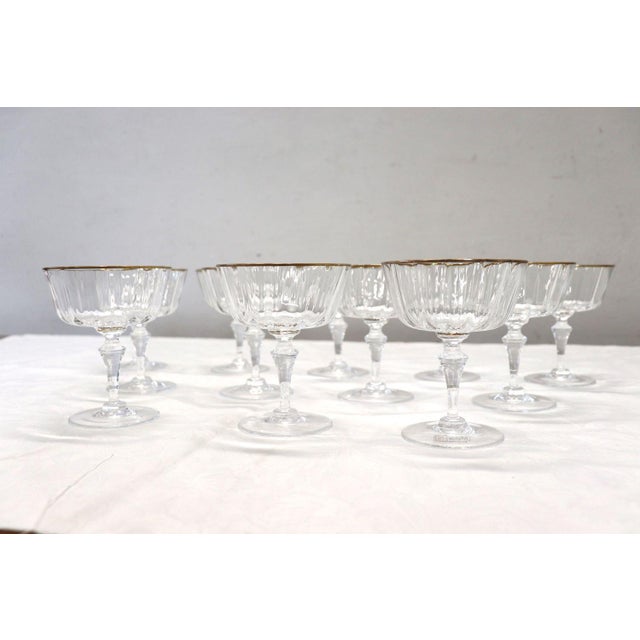 We offer this refined vintage set of 12 Murano blown glass champagne glasses. This set is inspired by the historic Murano...