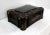 Black lacquer box with Japanese gilded decorations presenting curved forms and four prominent angles. This small chest...