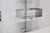 A pair of modular wall shelves designed by Vittorio Introini, produced by Saporiti, Italy, circa 1969. Stainless steel,...