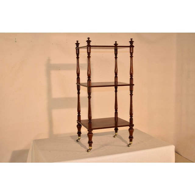 19th century mahogany etagere or shelf with lovely hand turned shelf supports. The shelf has nicely hand turned finials on...