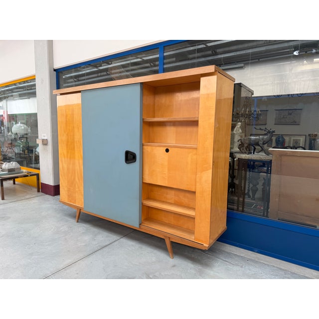 A rare multifunctional wardrobe, with a coat rack, a writing desk, and a bookcase. Attributable to the work of Gio Ponti,...