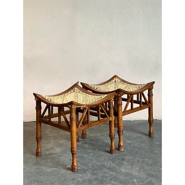 Presenting a captivating pair of Vintage Boho Woven Rattan Thebes Stools, embodying an exquisite blend of natural charm...