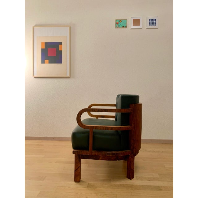 Very rare original from the period between Modernism and Art Deco. Reupholstered with dark green leather a few years ago.