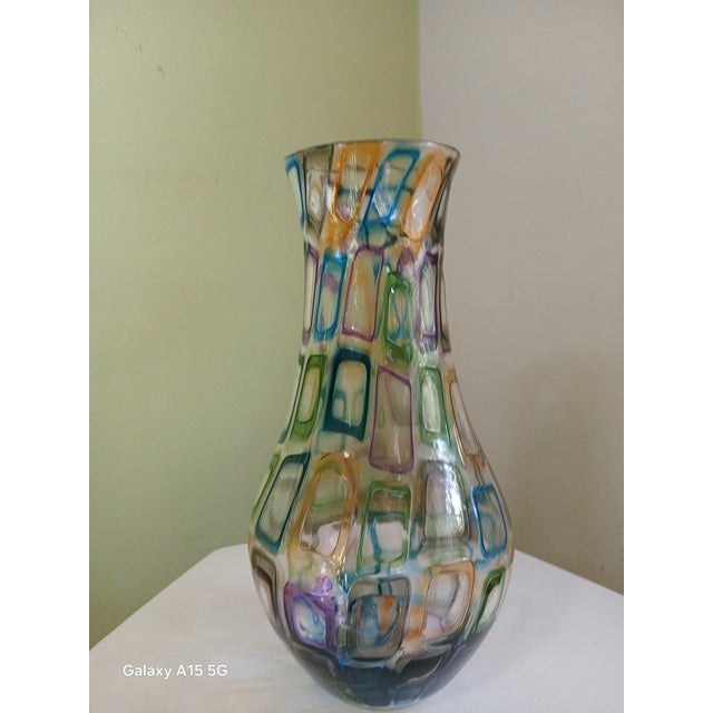 This beautiful vase stands 9- inches tall. It's signed and dated "2001". It's in excellent condition. No chips or cracks....