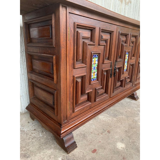 From Northern Spain, constructed of solid oak, the rectangular top with molded edge atop a conforming case housing six...