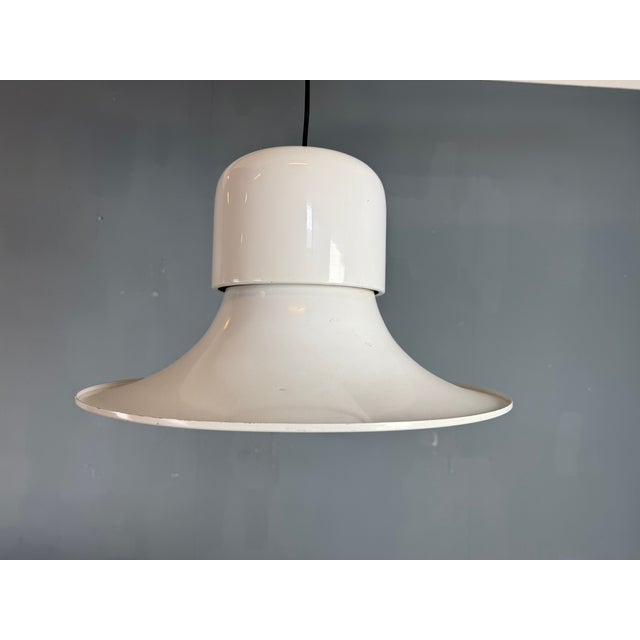 Elegant vintage Campana pendant lamp in the smaller execution, featuring a sculptural bell-shaped form. This timeless...