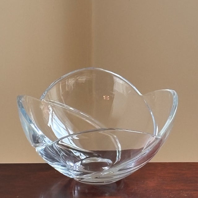 A beautifully sculptural freeform art glass centerpiece bowl showcasing the timeless elegance of Mid-Century Modern...