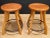 Uniquely designed wood and iron stools. Farmhouse country style with ax handle form legs supported by through dowels and...