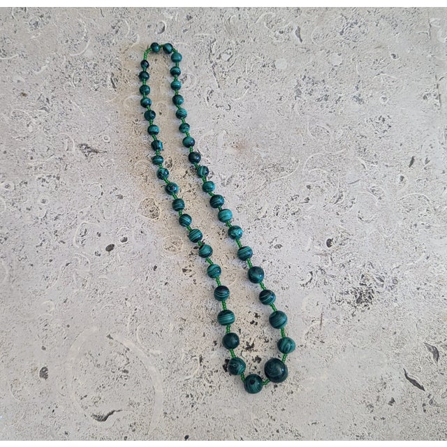 Graduated Malachite beaded 21". Purchased in the 70's from the Zaire (now the Congo). It is hand strung uniquely without a...