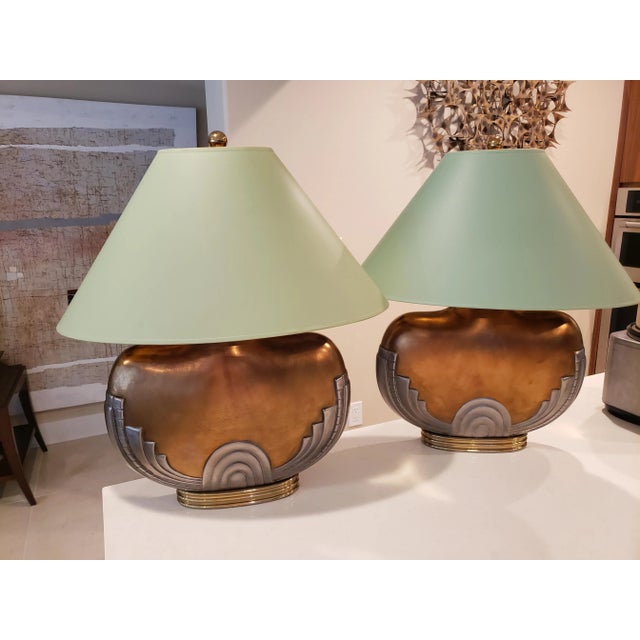 This listing consists of a beautiful pair of art deco table lamps by Chapman from the 1984. Both shades and lamps are in...