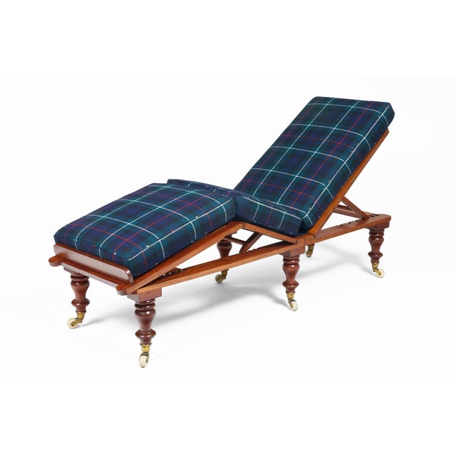 Mahogany campaign folding and adjustable daybed with three caned sections that will adjust their angle on a rachet letting...