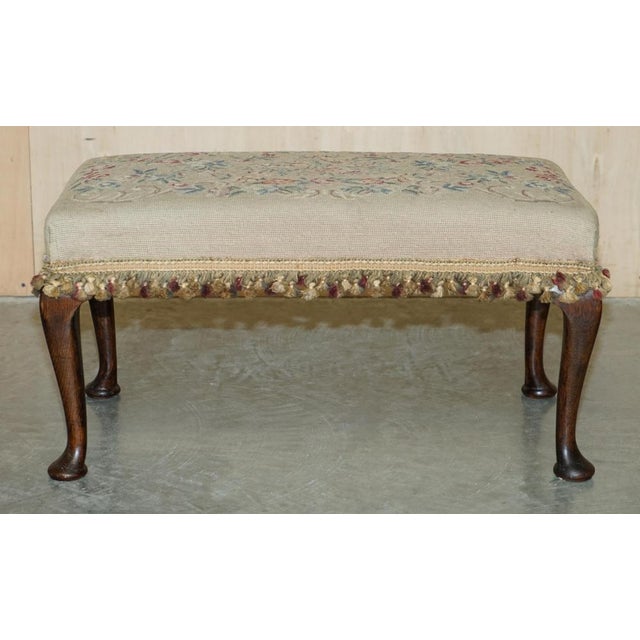 Lovely original Victorian circa 1880 hand carved oak Cabriolet legged footstool with floral embroidered upholstery A very...