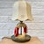 A rare Swedish table lamp designed as a stylized lifebuoy, produced in Stockholm during the 1940s by Olof Heijke. The...