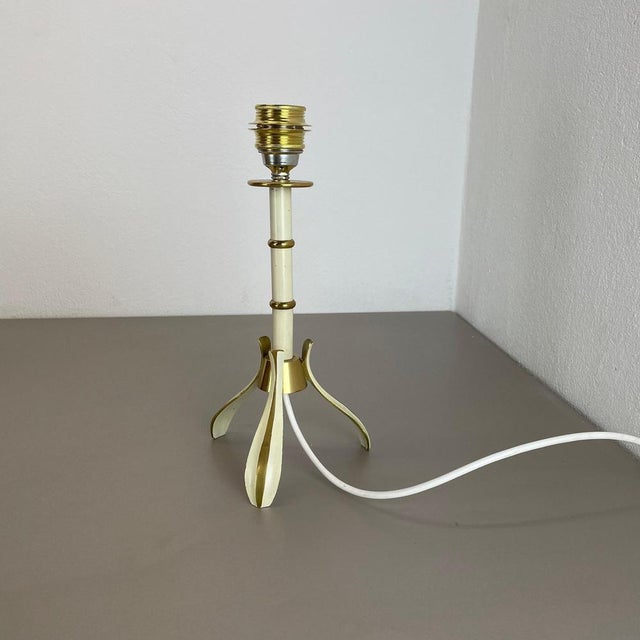 Article: Table light Origin: Germany Producer: Vereinigte Werkstätten München Age: 1950s. This original vintage Minimalist...