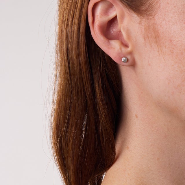 These elegant vintage diamond bezel stud earrings are a classic 1970’s design, offering refined sparkle in a timeless...