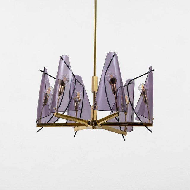 A stunning mid-century italian chandelier, attributed to stilux milano and crafted in the 1970s. This sculptural piece...
