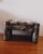 Vintage Parsons style upholstered ottoman featuring substantial fully upholstered legs and a loose seat cushion wrapped in...