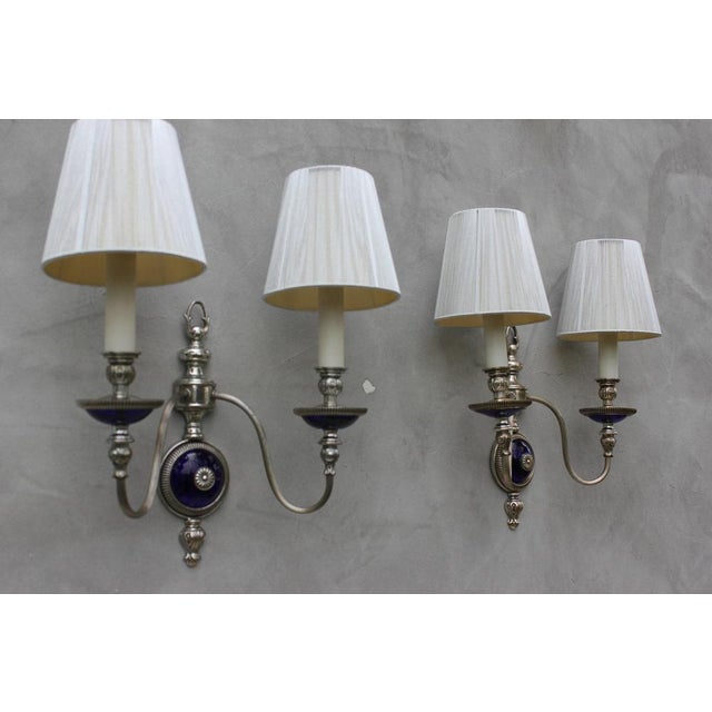 Pair of vintage French style wall sconces, each with two branches, white metal, probably zinc or white bronze. Cobalt...