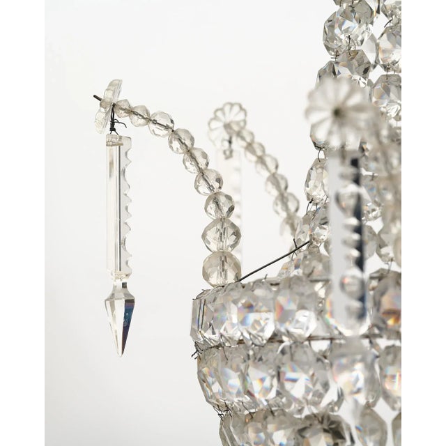 Chandelier, French, by Baccarat with the original cut crystals and pendants. Current height from ceiling is 52".