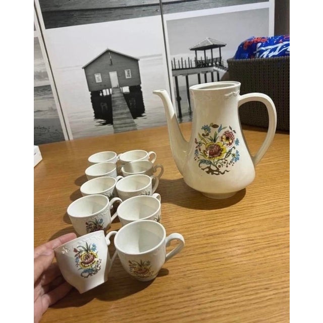 A charming vintage French coffee service by Sarreguemines-Digoin, decorated in the colourful Cantaloup pattern. The set...