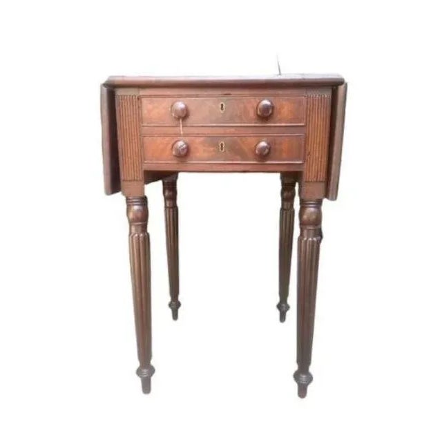 A late 19th century side table with extending leaves and 2 drawers — perfect as a nightstand. Measures 16"W x 18.5"D x...