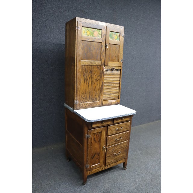 Rare salesman sample style Hoosier cabinet in oak featuring many of the functional details found in full-size examples,...