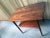 Mid century modern side table by MM Moreddi. Features solid teak rectangular table with for legs and bottom shelf. Made in...