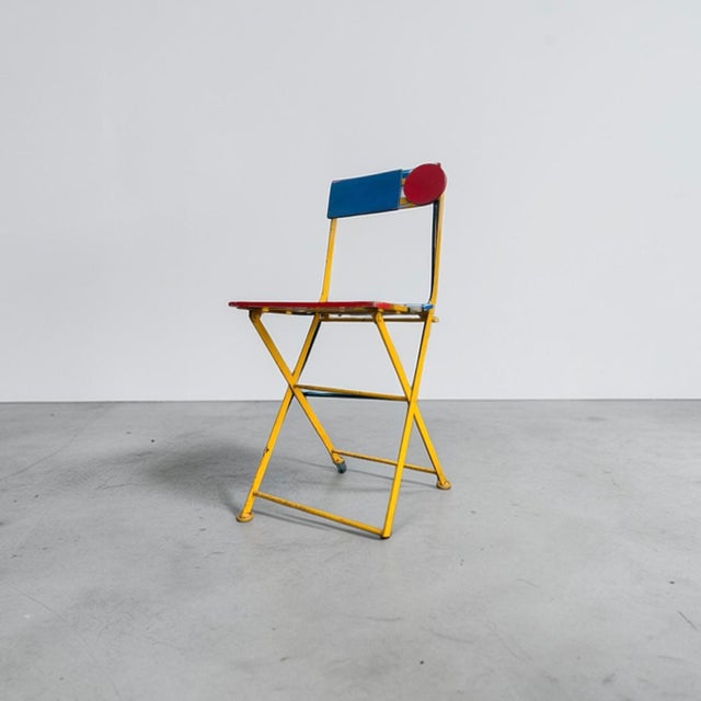 Postmodern folding bistro chair designed by denis balland for fermob, france, 1985. the chair features a lacquered steel...