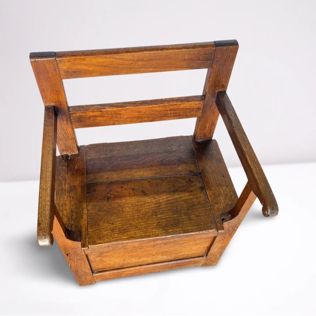 Early 18th century French Country bench chair. Its sturdy pegged construction and aged patina evoke a sense of history,...