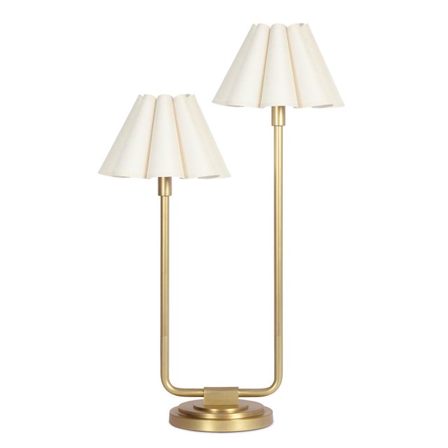 An imaginative twist on a classic style, the Polly Double Arm Table Lamp reaches upward with twin scalloped shades that...