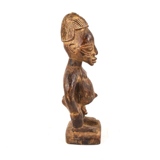 Ibeji figures, carved by the Yoruba people of Nigeria, are wooden twin sculptures holding cultural significance in Yoruba...