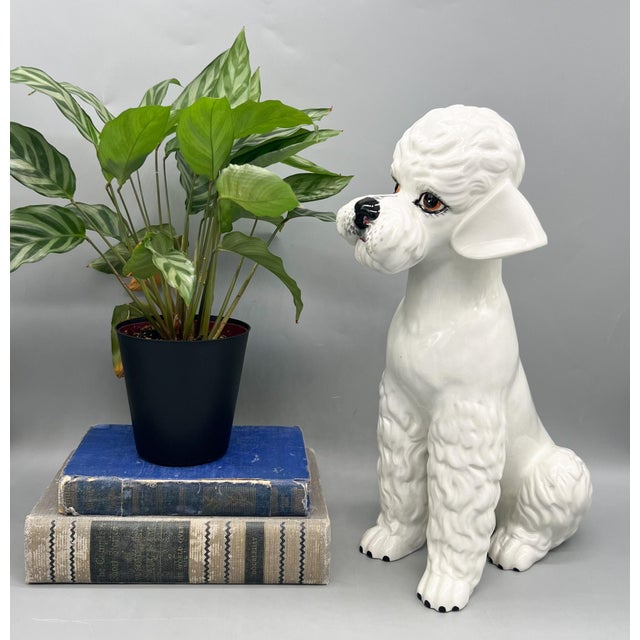 Whimsical, large vintage Italian ceramic poodle statue, featuring a stylized seated form with sculpted curls and...