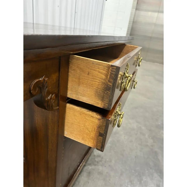 Offered is an antique sideboard credenza. This piece features solid wood, dovetailed drawers with original hardware. Base...