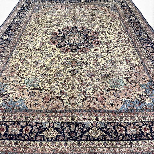 A beautiful large-scale vintage rug featuring an elegant central medallion surrounded by an abundance of richly detailed...