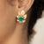18K Earrings by Keith Davis with 2 Colombian emeralds weighing 3.22 carats, 6 marquis cut diamonds weighing 2.56 carats...