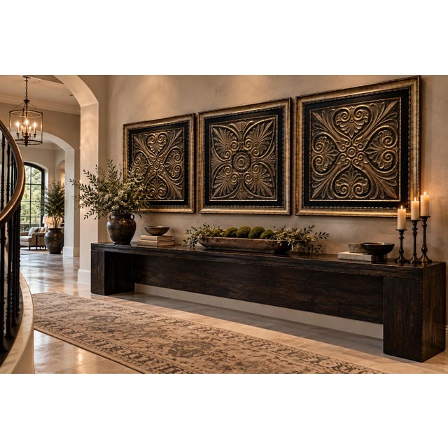 A dramatic set of three oversized decorative wall panels featuring richly dimensional architectural-inspired scrollwork in...