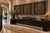 A dramatic set of three oversized decorative wall panels featuring richly dimensional architectural-inspired scrollwork in...