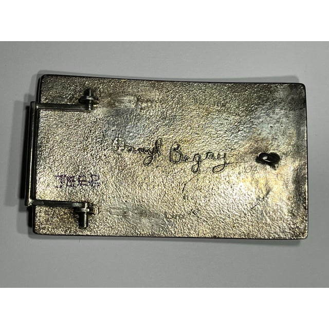 Sterling silver belt buckle With Turquoise sculptured Onyx with drawings by Darryl Begay A monumental belt buckle, one of...