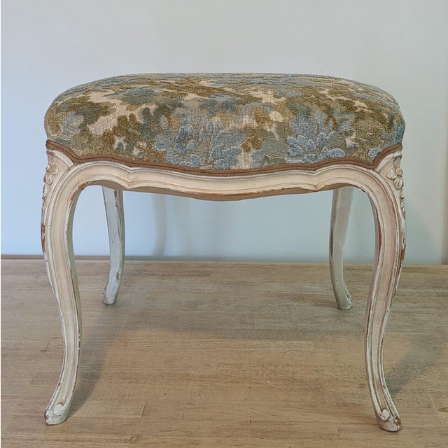 The cutest antique French footstool in a distressed cream paint. Excellent antique condition, and very sturdy. Pretty...