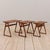 A stunning set of three vintage nesting tables made of teak and designed in the style of j. Andersen cfc comes from...