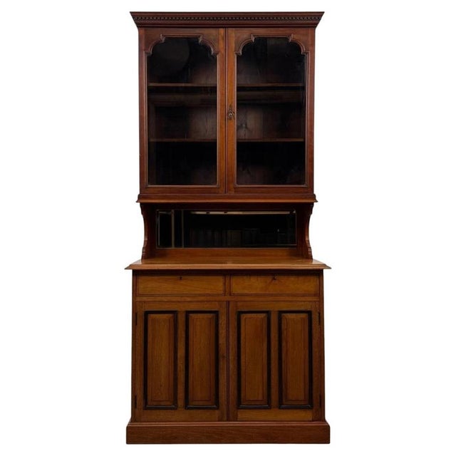 A superb and exceptionally well-crafted early 20th-century English Edwardian bookcase, finely constructed in walnut and...
