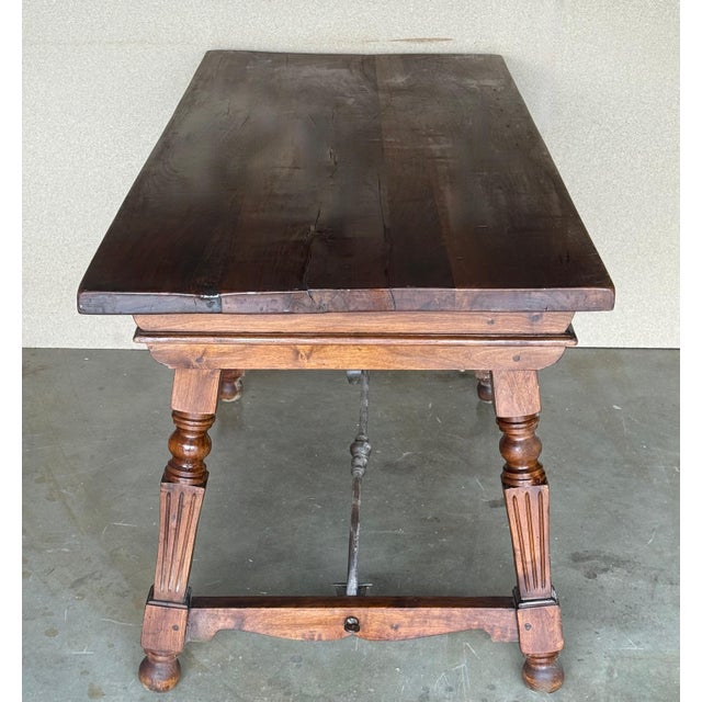 Height from the floor to the bottom drawer: 23.42in An 19th century Spanish baroque desk, or writing table made of solid...