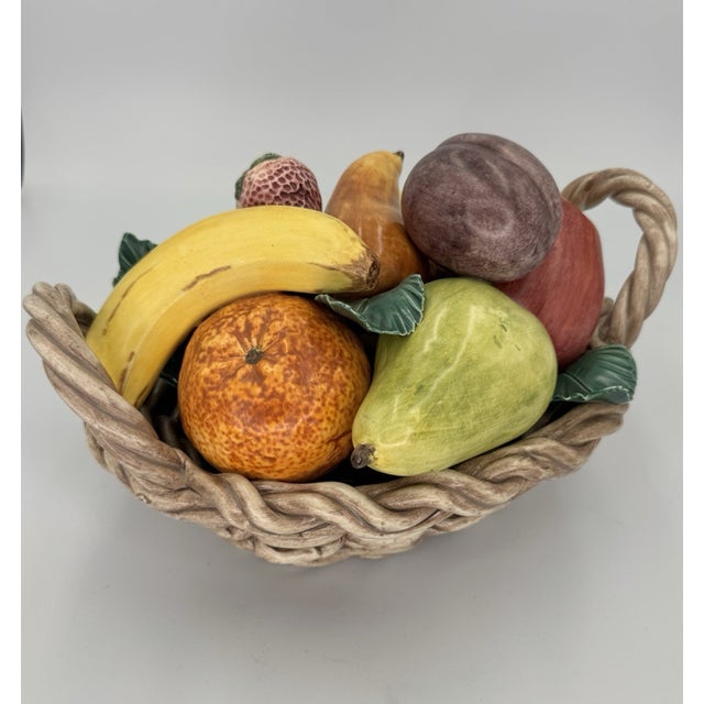 Bring timeless Italian craftsmanship and Mid-Century Modern charm to your home with this vintage Italian ceramic fruit...