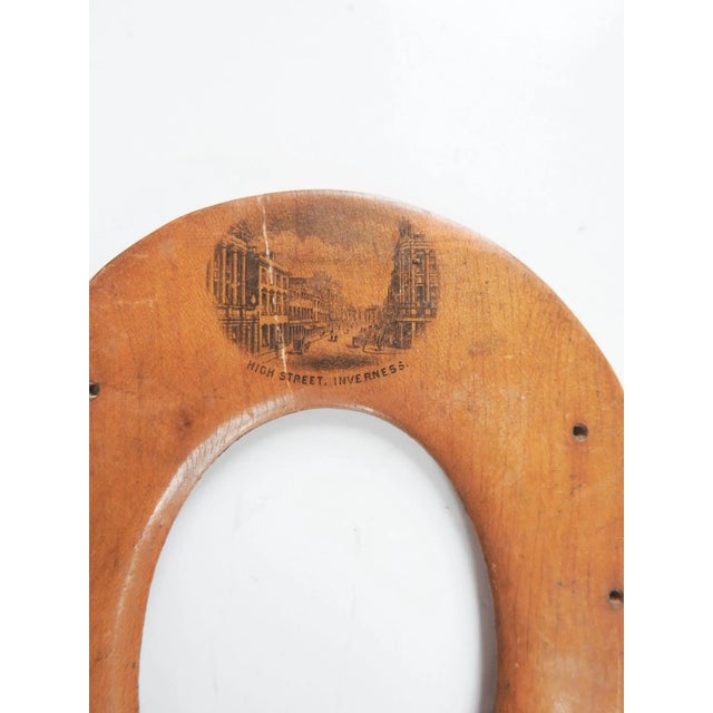 Antique circa 1890's Mauchline or treenware souvenir picture frame. Carved in the shape of a horseshoe with a lithographed...
