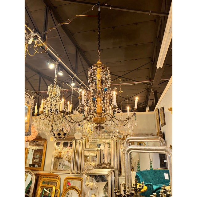 This 18th c. Italian Giltwood and Crystal Chandelier features carved giltwood and beautiful crystals. From Genoa Italy,...