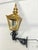 A handsome traditional brass wall lantern with decorative cast iron mounting bracket, combining classic architectural...