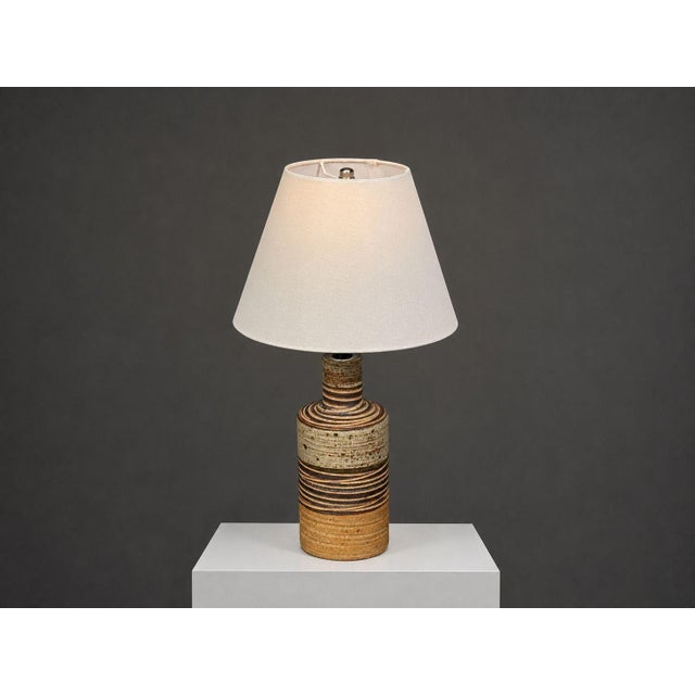 Tue Poulsen, Danish Mid-Century Modern, Table Lamp, Beige Ceramic, Denmark, 1950s A partially glazed stoneware table lamp...