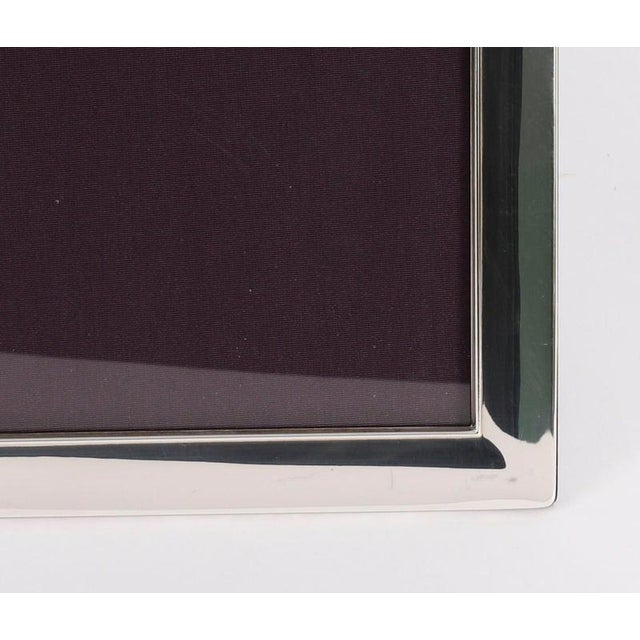 A truly superb high quality large photo frame in sterling silver by the world renowned retailer Asprey, bearing the...